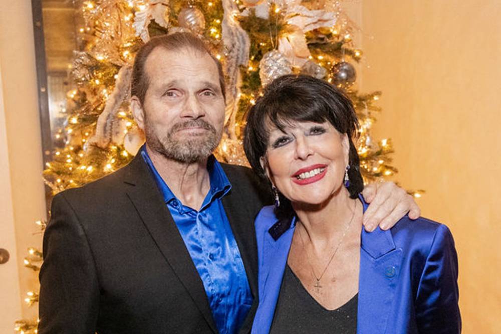 President Philomena Mantella and husband smiling at camera
